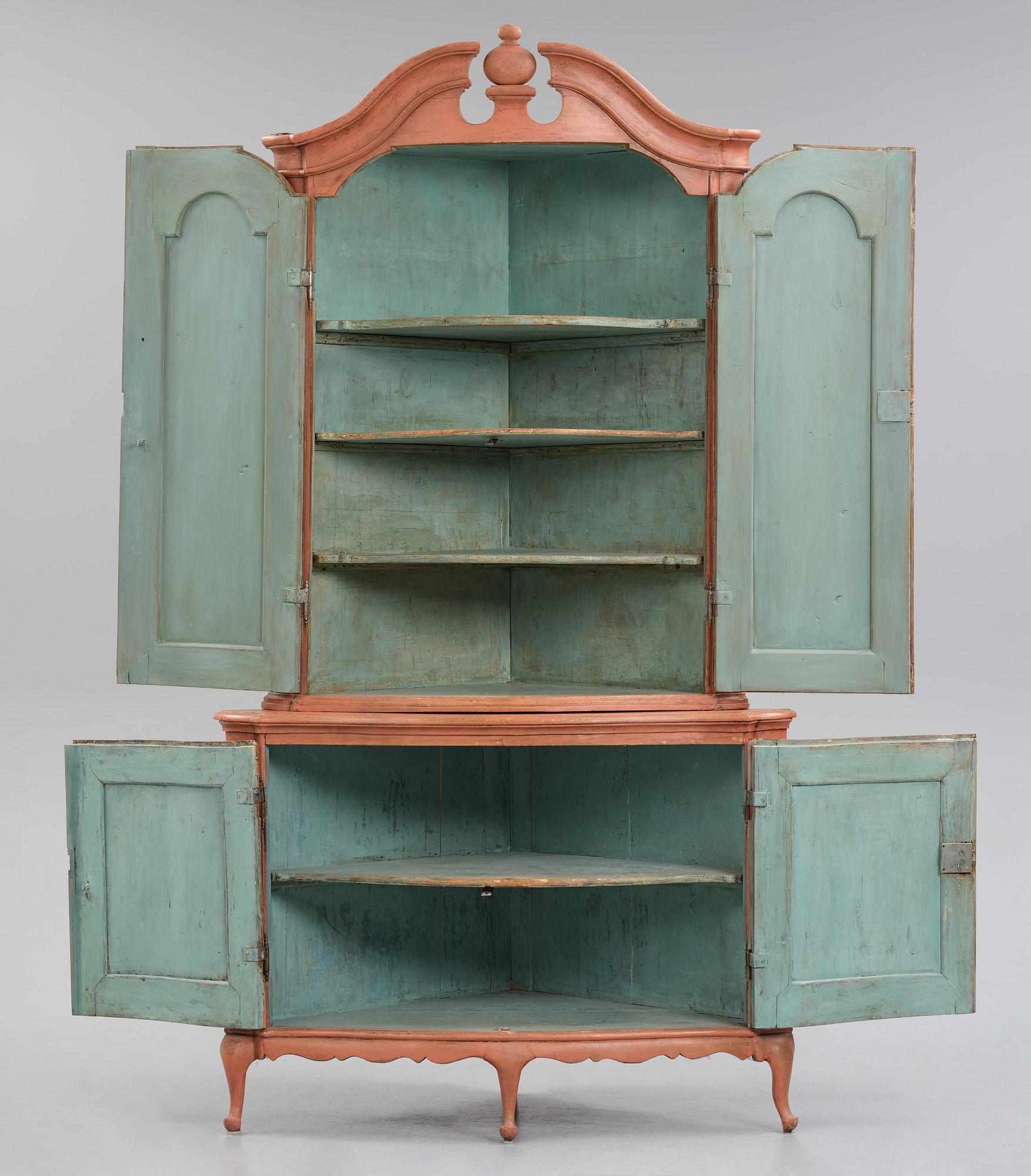 A rococo corner cabinet, later part 18th century.