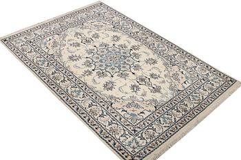 A Nain part silk rug, c. 193 x 148 cm.
