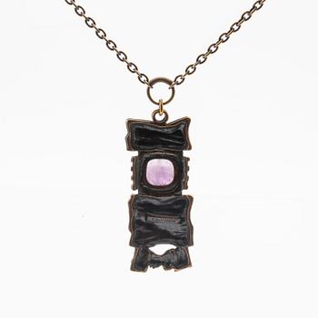 A bronze necklace set with an amethyst by Pentti Sarpaneva.
