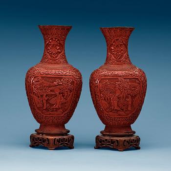 A pair of red lacquer vases, late Qing dynasty.