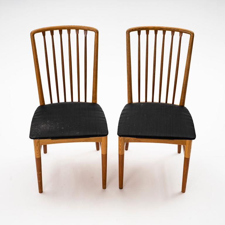 A pair of Scandinavian Mid Century Modern teak, oak and elm chairs.