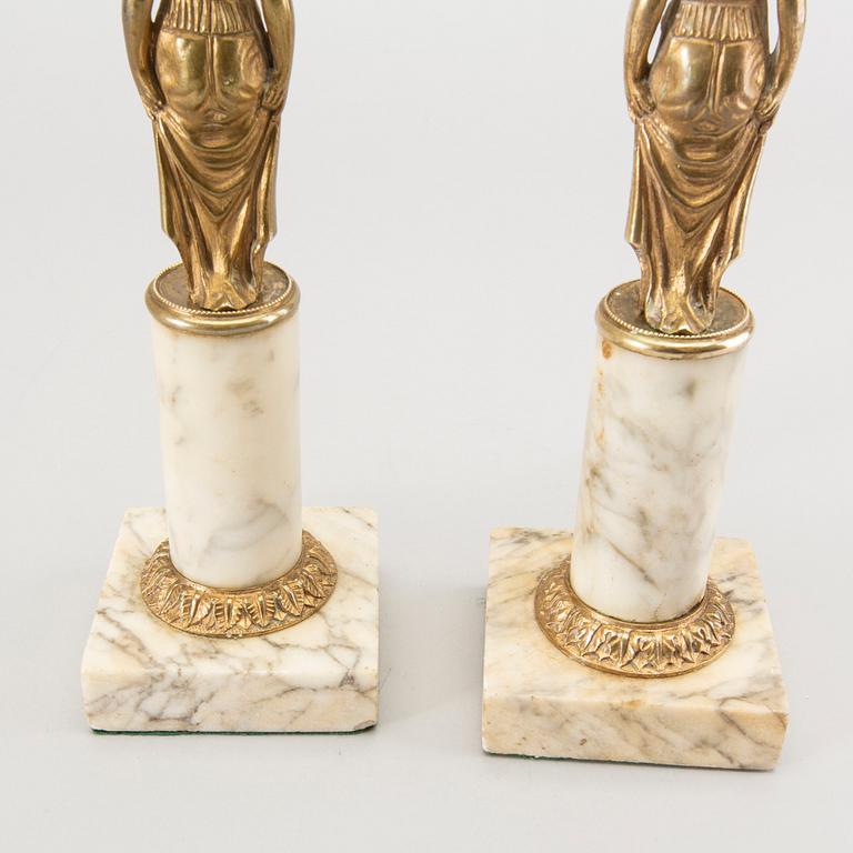 A pair of Gustavian style candle sticks around 1900.