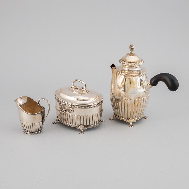 A swedish silver coffee pot, creamer and sugar box, J.E. Torsk, Stockholm 1900.