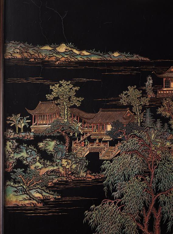 A set of four Chinese lacquer panels with wooden frames, early 20th century.