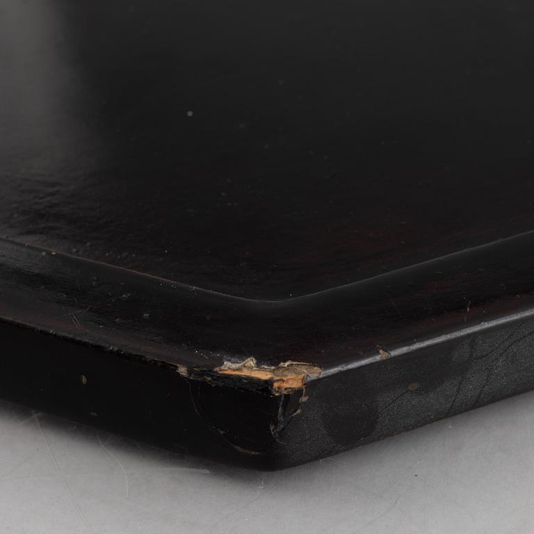 Four black-lacquered wall decorations, China, around 1900.