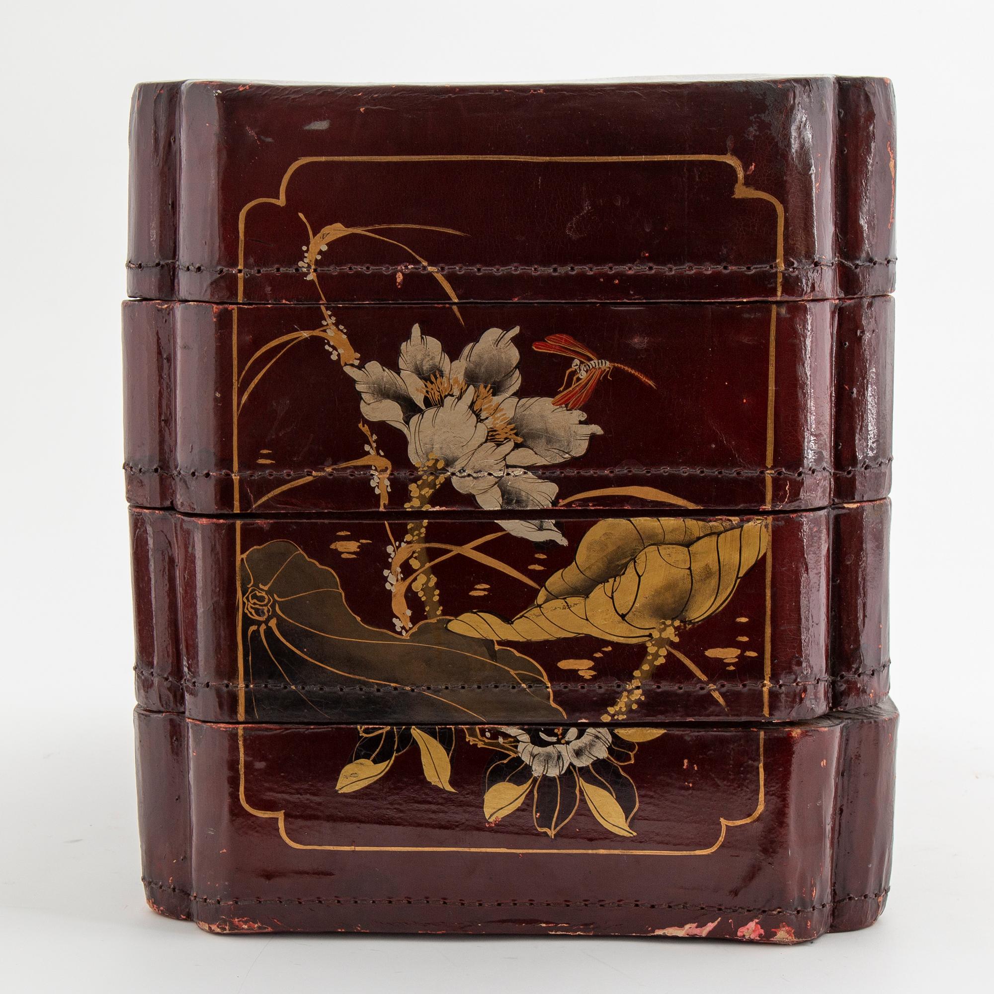 A painted Japanese four tiered box, 20th Century.