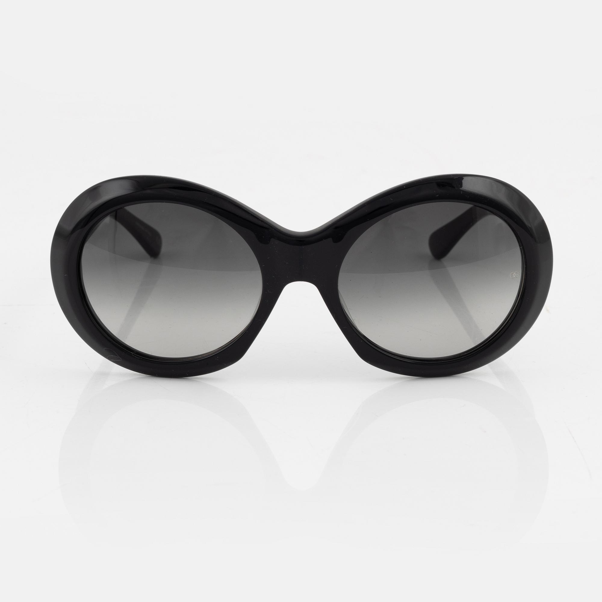 Oliver Goldsmith, a pair of black "Audrey" sunglasses.