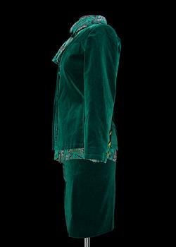 A green velvet jacket by Yves Saint Laurent.
