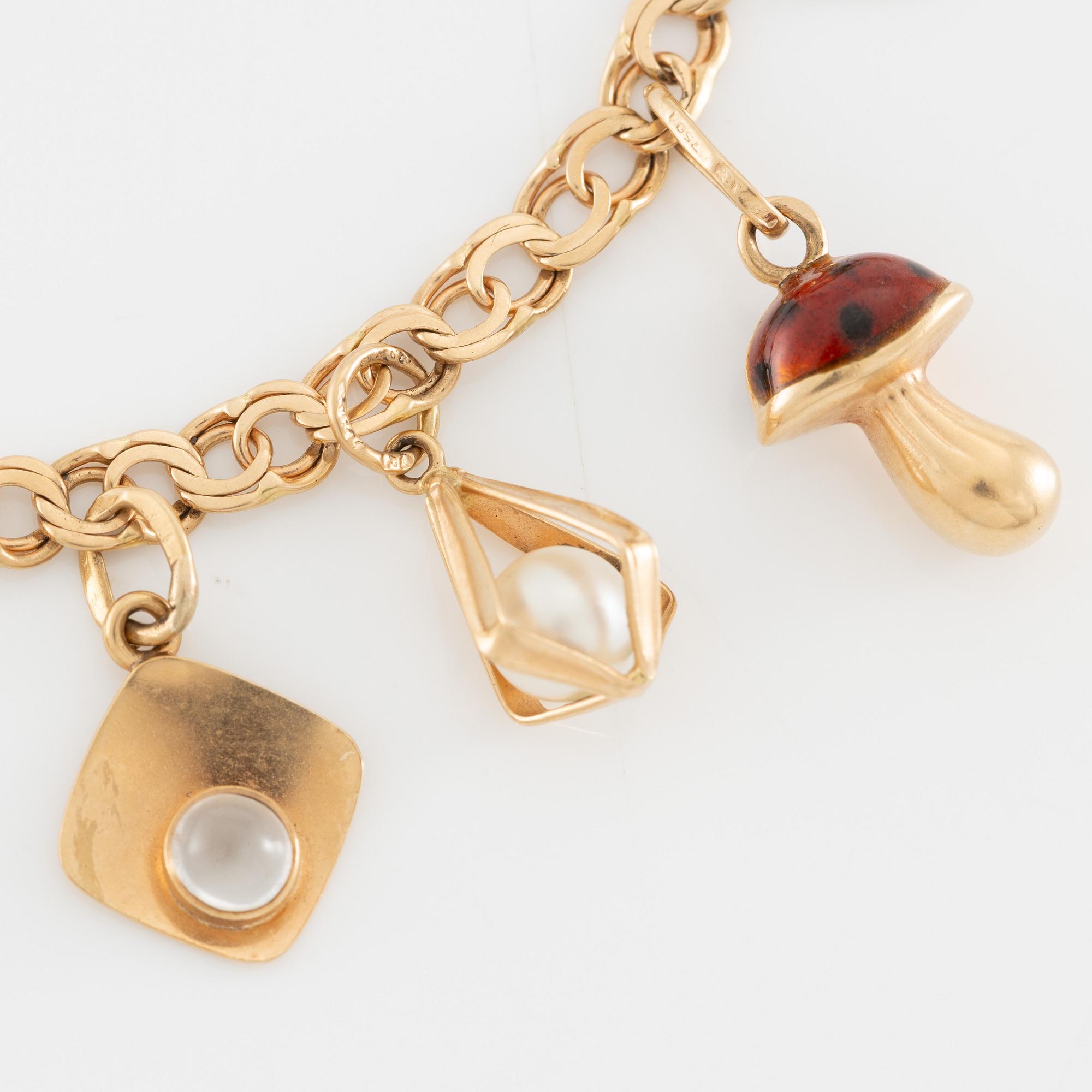 Armband 18K guld med berlocker.