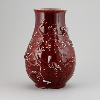 A red glazed Chinese vase, 20th century.