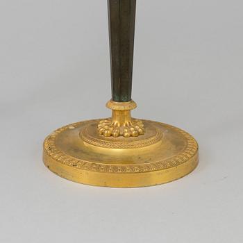 A pair of French Directoire late 18th century ormolu candelabra for three candles.