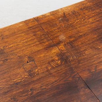 An oak dining table, Baroque early 18th century and Baroque style 19th/20th century.