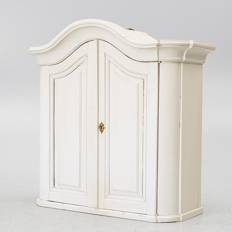 A Swedish rococo hanging cabinet, mid 18th century.