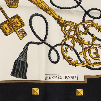 Hermès, a 'Les Clefs' silk scarf.