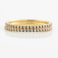 Ringar, Georg Jensen. ett par, "Signature", 18K guld med briljantslipade diamanter.