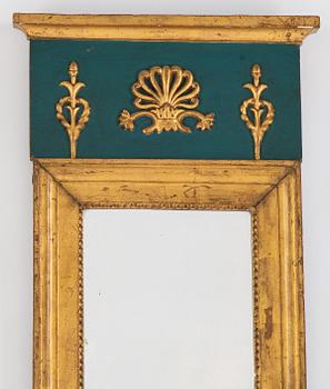 An Empire mirror, first half of the 19th century.