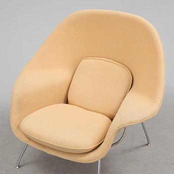 EERO SAARINEN, a "Womb chair" by knoll international.