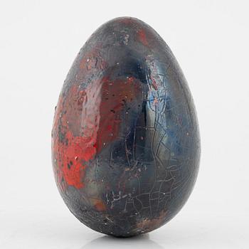 a faience sculpture of an egg, Biot, France.