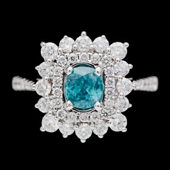 268. RING, brilliant cut diamonds, tot. app. 1.40 cts and natural blue zircon.
