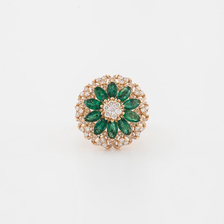 An marquise cut emerald and brilliant cut diamond ring.