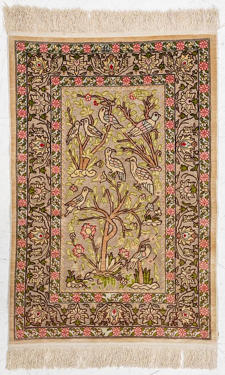A silk an metal Hereke rug, West Anatolia, c. 100 x 68 cm.