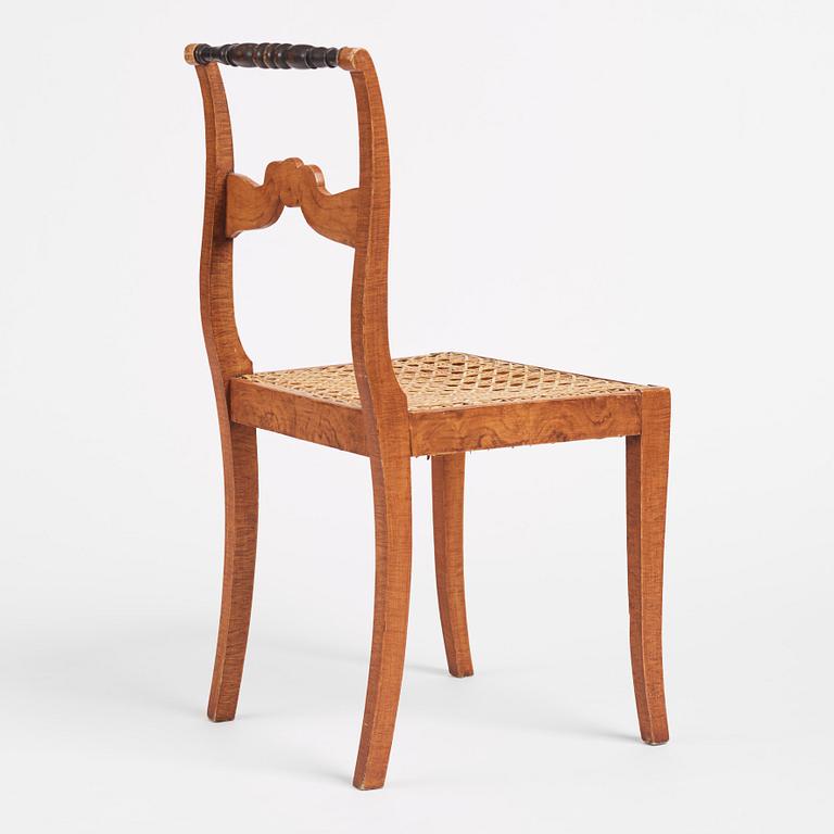 An Empire chair, first half of the 19th century.