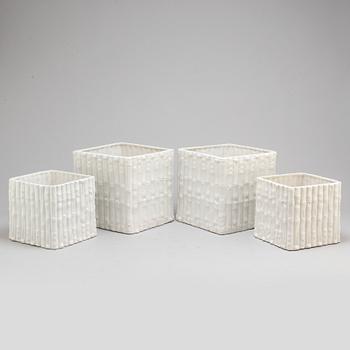 a set of four ceramic flower pots from Italy in the second half of the 20th century.