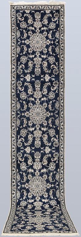 A Nain runner, part silk, approx. 405 x 77 cm.