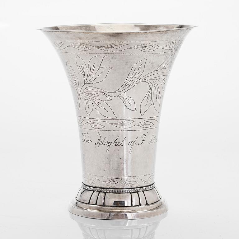 A silver beaker, maker's mark Isak Carlstedt, Porvoo ca. 1831, and silver spoon by Carl Fredrik Borgström, Turku 1803.