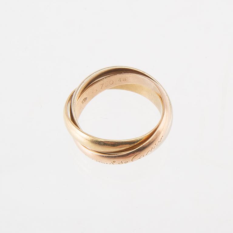 An 18K tri-coloured "Trinity" gold ring by Cartier.