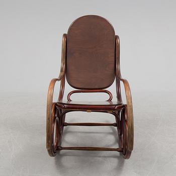 A stained rocking chair by Thonet, about 1900.