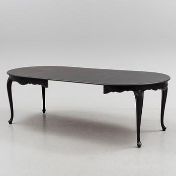 A mid 20th century rococo style dining table.