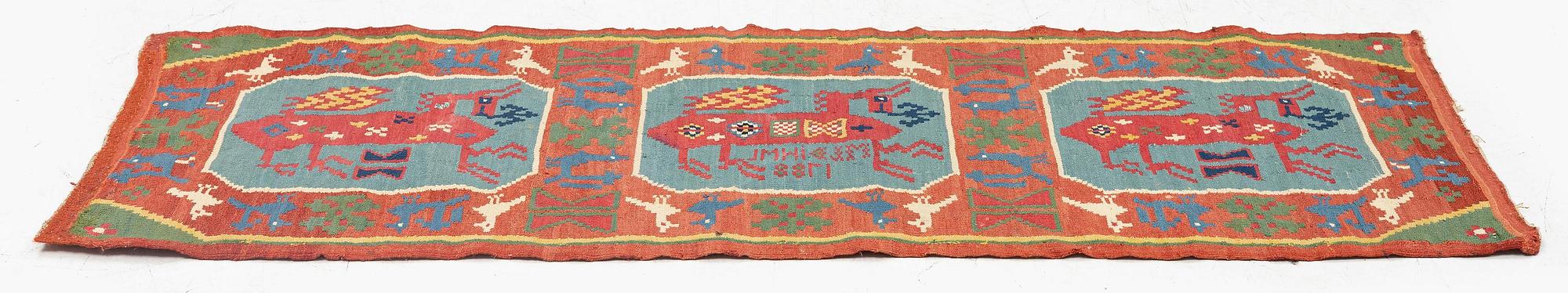 A double-interlocked tapestry carrige cushion, ca 108 x 51 cm, 'Bäckahästen', dated 1788.