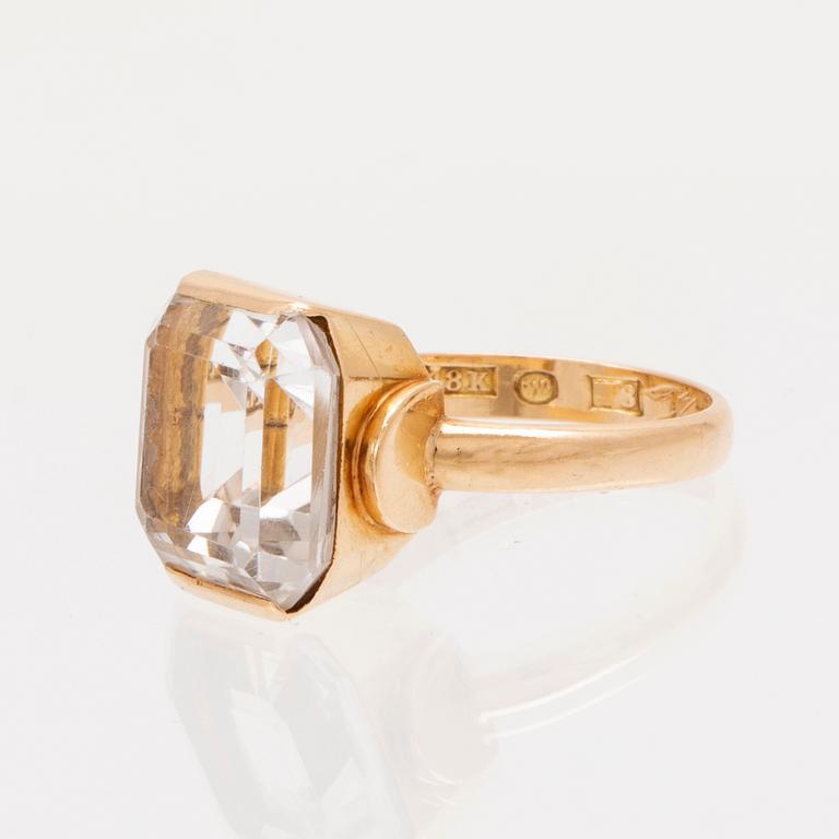 Ring och örhängen 18K guld samt fasettslipade bergskristaller.