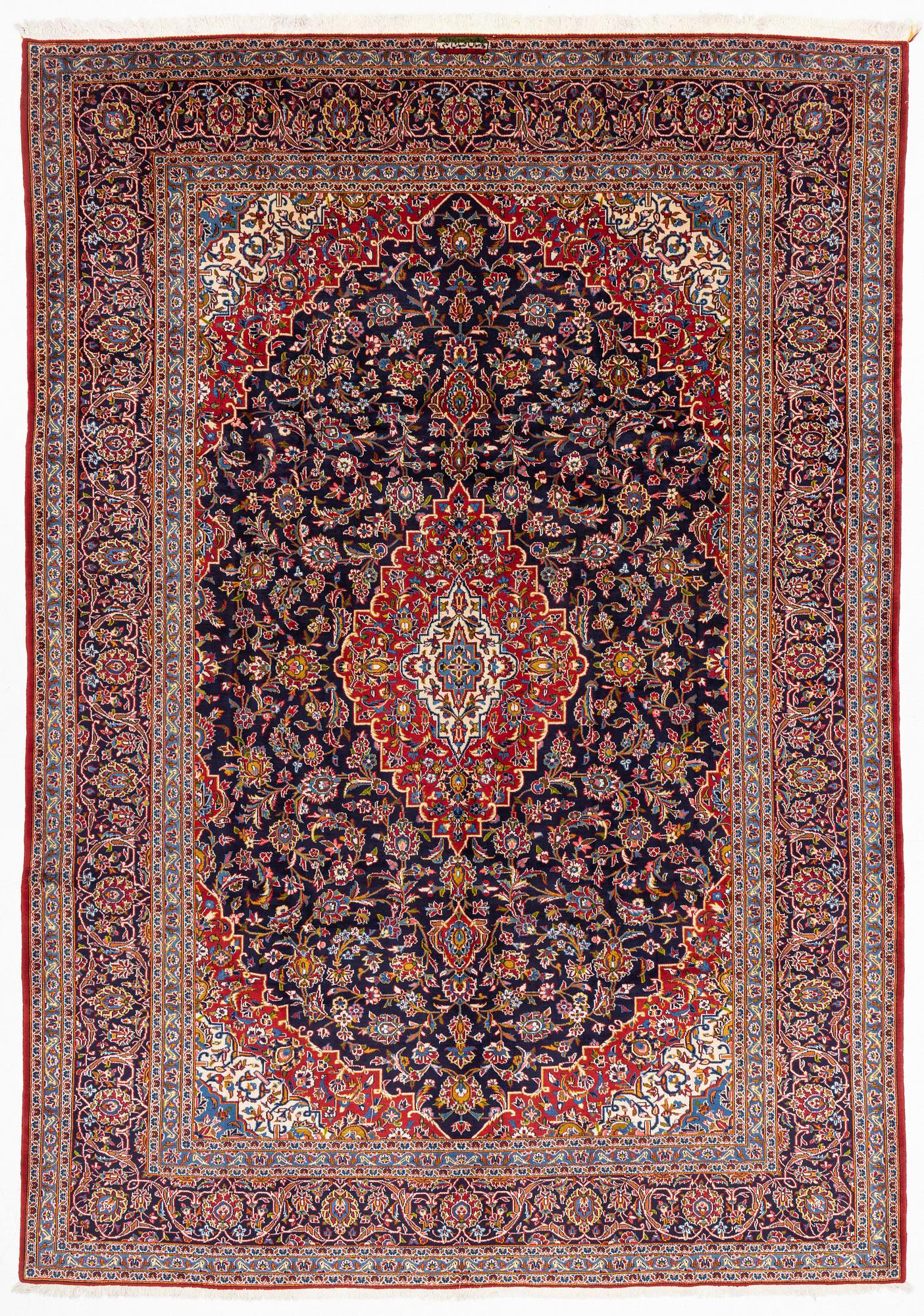 A Kashan carpet signed, approx. 420 x 292 cm.