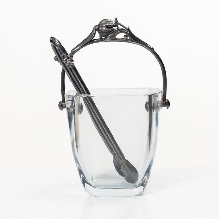 Ice bucket, glass, Strömbersghyttan, with mount and tongs in Danish silver, circa mid-20th century.