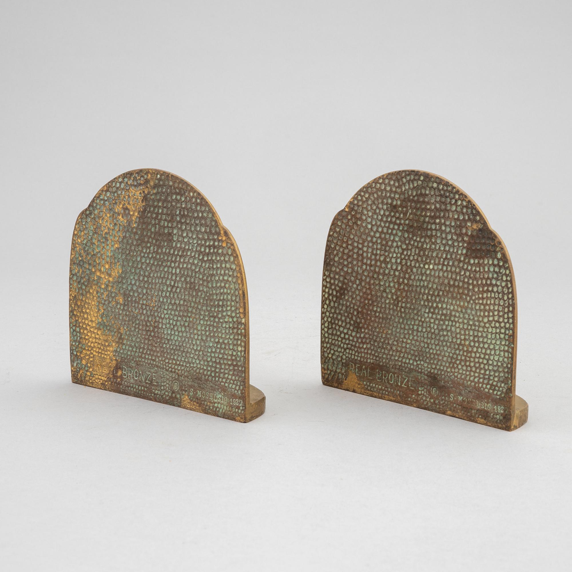 Simon Moselsio, a pair of bronze bookends, 20th Century.