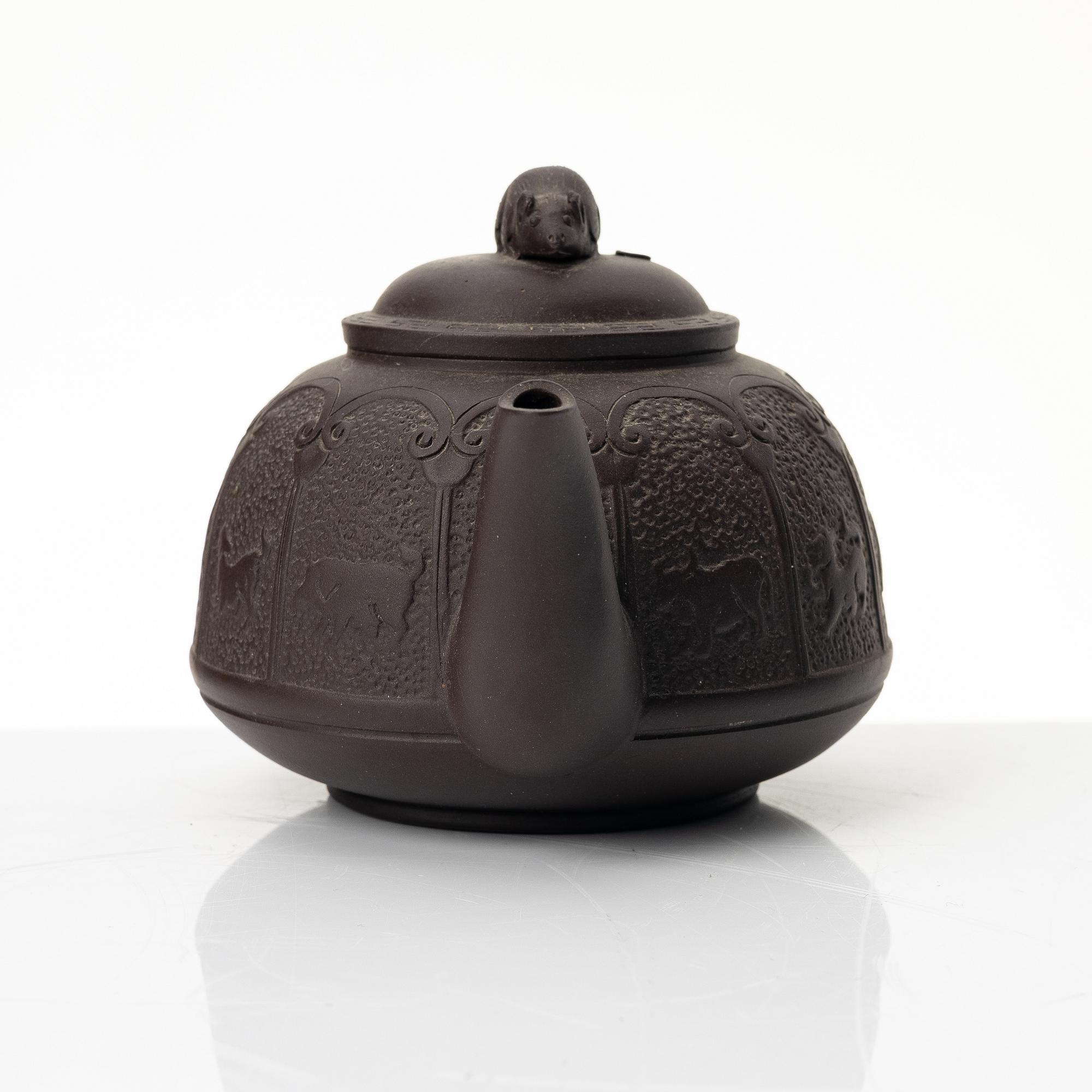 Bao Zhenglan, A brown yixing 'zodiac' teapot, China, 1990s.