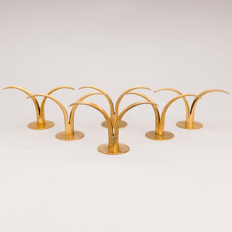 Six brass candle sticks "Liljan" by Ivar Ålenius-Björk for Ystad metall, second half of the 20th century.