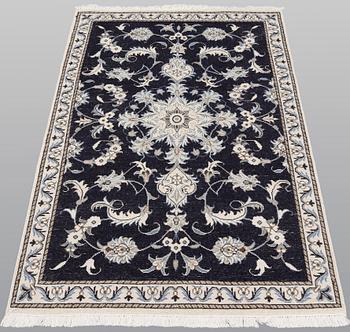 A pair of Nain rugs, ca 135 x 90 & 134 x 89 cm.
