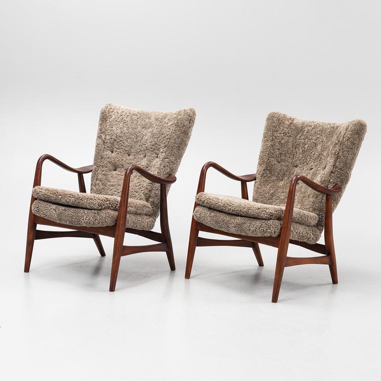 Ib Madsen & Acton SChubell, a pair of 'Pragh' armchairs, Madsen & SChubell Co, Denmark, 1940's/50's.