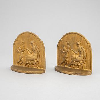 Simon Moselsio, a pair of bronze bookends, 20th Century.