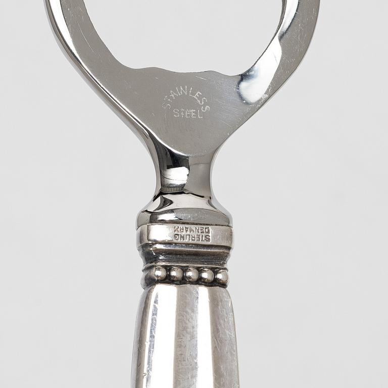 Kapsylöppnare samt sked, silver, "Konge", Georg Jensen.