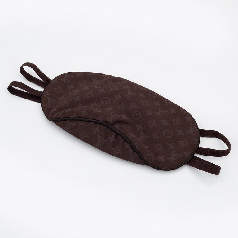 Louis Vuitton, a monogram "Trousse kit de voyage' travel kit with inflatible pillow and eye mask.