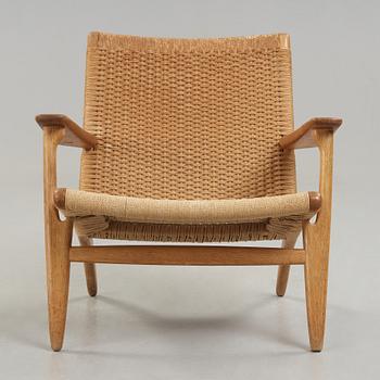 A Hans J Wegner 'CH-25' oak easy chair, Carl Hansen & Son, Denmark.