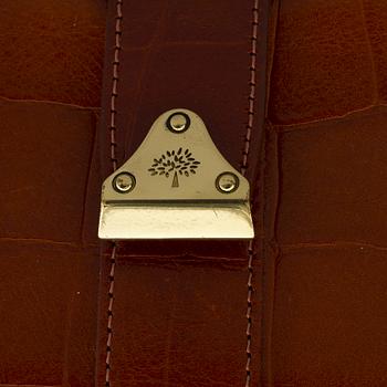 A leather clutch by Mulberry.