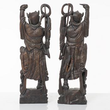A pair of Chinese hardwood figures, 20th century.