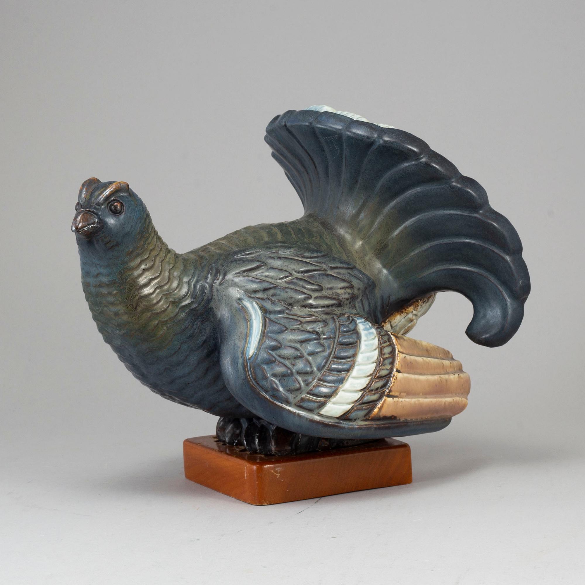 GUNNAR NYLUND, a stoneware sculpture of a grouse, Rörstrand, Sweden.