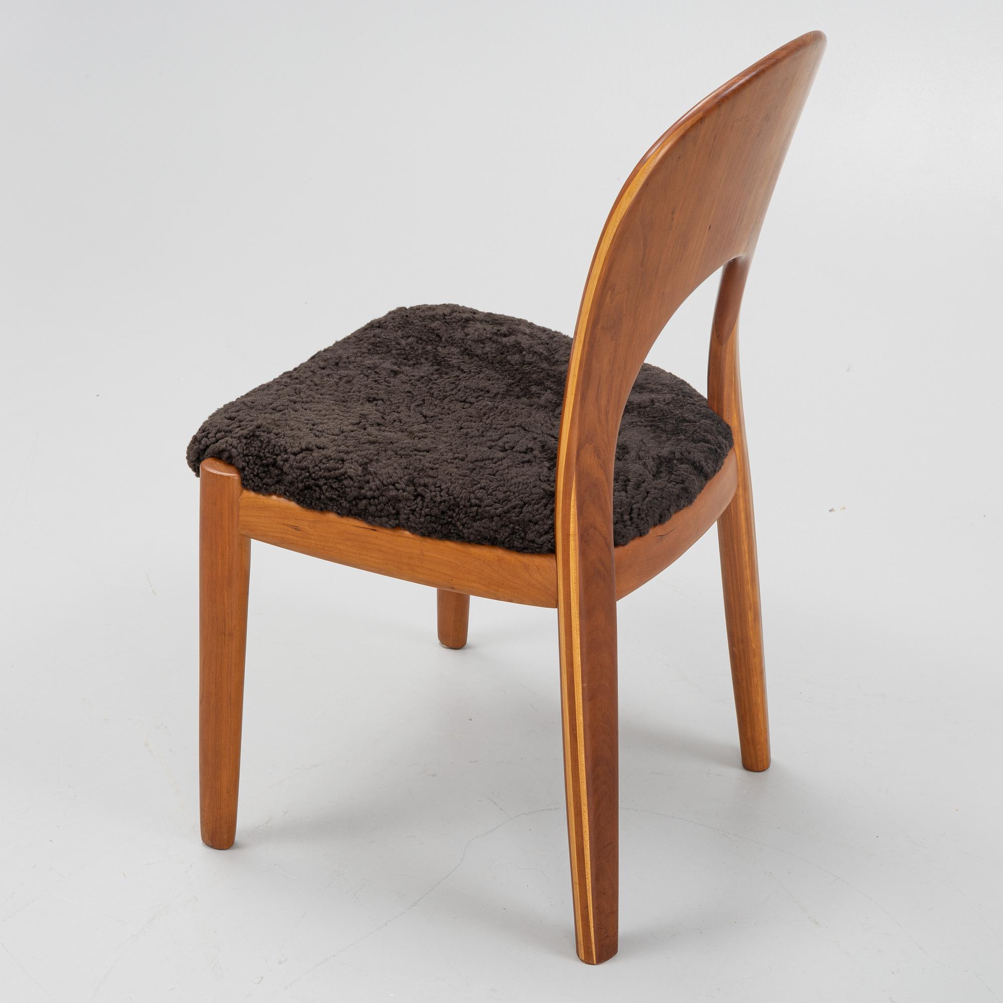 Niels Koefoed, eight teak dining chairs upholstered in new sheep skin, Denmark, 1960's.