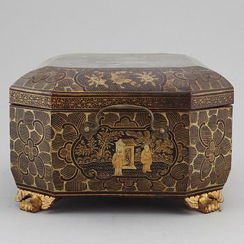 A lacquered sewing cabinet, Qing dynasty, 19th century.